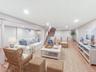 Here is the basement staged to be another living room that will be perfect for movie nights!