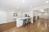 Kitchen - Island overlooking den and view into dining & living rooms