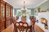 Formal Dining Room With Fireplace & Wainscoting