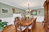 Formal Dining Room With Fireplace & Wainscoting