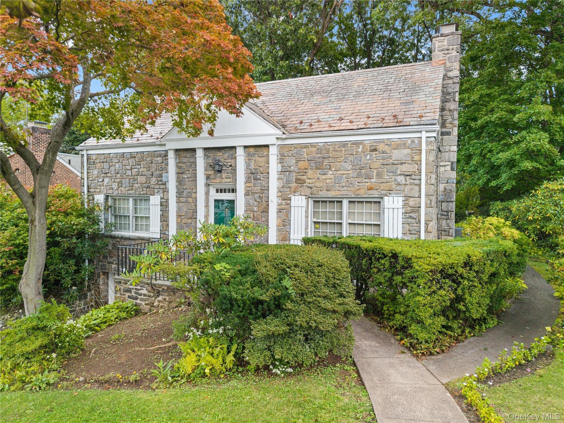 Welcome home to 28 Ritchie Drive, Yonkers - attractive stone home with classic slate room adds to home' curb appeal