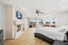 Large primary bedroom with gas fireplace and two sitting rooms