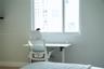 Large multi-pane window with a white frame and neutral wall finishes