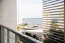 Private balcony featuring a metal railing with glass panels