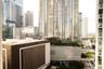 Urban skyline perspective featuring glass-curtain high-rise architecture and metropolitan density