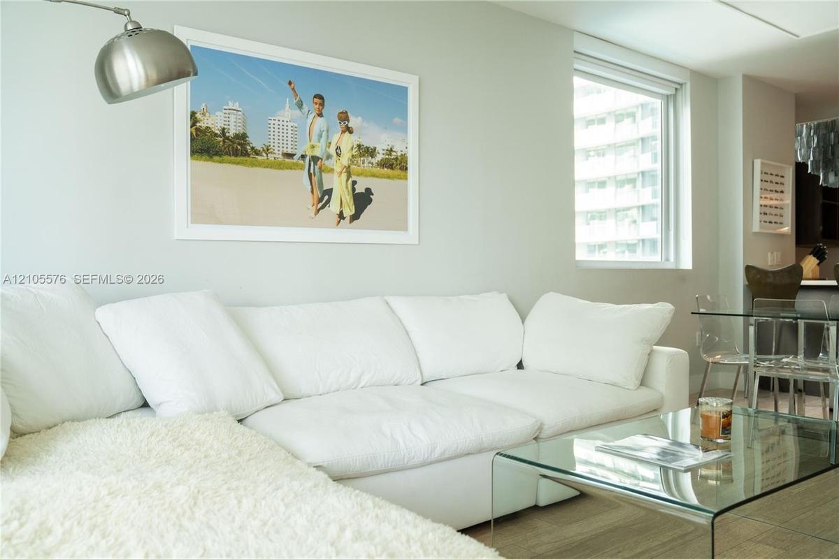 Neutral wall paint, wood-finish flooring, and recessed ceiling lighting