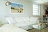 Neutral wall paint, wood-finish flooring, and recessed ceiling lighting