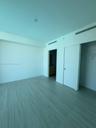 Room featuring wood-finish flooring, recessed ceiling lighting, and a sliding closet door