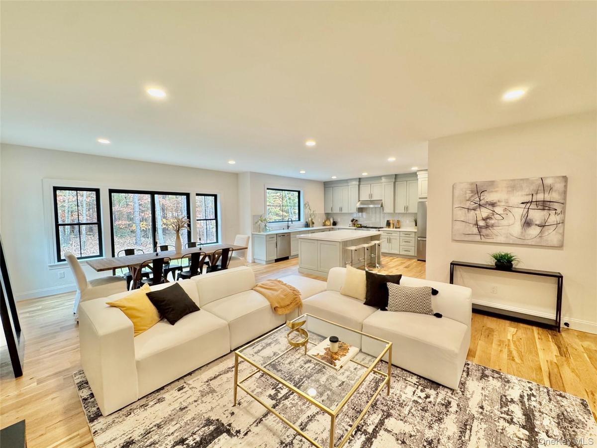 Living room featuring recessed lighting and light wood-style flooring