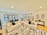 Living room featuring recessed lighting and light wood-style flooring
