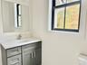 Bathroom featuring vanity and healthy amount of natural light