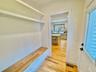 Mudroom featuring light wood-style floors and baseboards