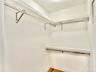 Spacious closet with light wood finished floors