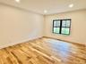 Empty room with recessed lighting and light wood-style flooring
