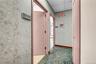 Corridor with carpet flooring and a paneled ceiling
