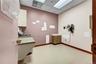 Misc room featuring a paneled ceiling and a sink