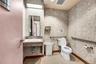 Bathroom featuring light tile patterned floors and vanity