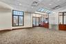 Unfurnished room with a drop ceiling, recessed lighting, and carpet