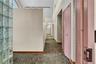 Hallway with dark carpet and track lighting