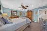 Bedroom featuring recessed lighting, a ceiling fan with integrated light fixture, carpeted flooring, and a mirrored closet