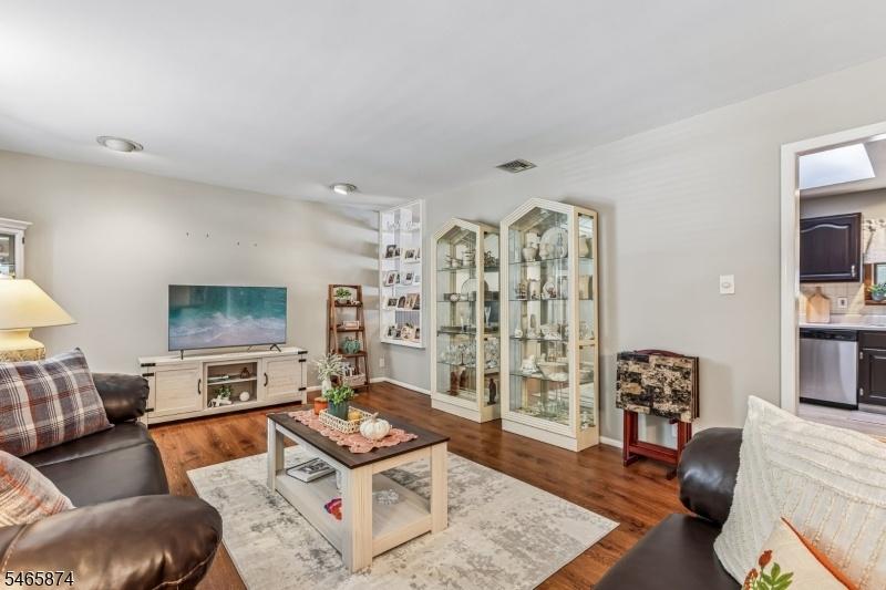 OPENS TO KITCHEN