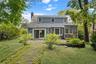Patio and grassy yard