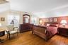 Large and inviting primary bedroom with large closets