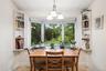 Kitchen dining area has view of backyard