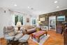 Family Room with Stone Accent Walls and wood flooring