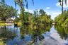 A private dock and boatlift provide access to Lake Sheen and the entire Butler Chain, while a gated community boat ramp is approximately 300 feet away
