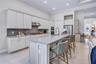 Beautifully appointed kitchen featuring generous counter space and stylish finishes.