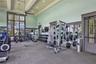 Additional view of the community fitness center and exercise equipment.
