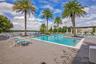 Relax and unwind at the stunning resort-style community pool surrounded by tropical landscaping.