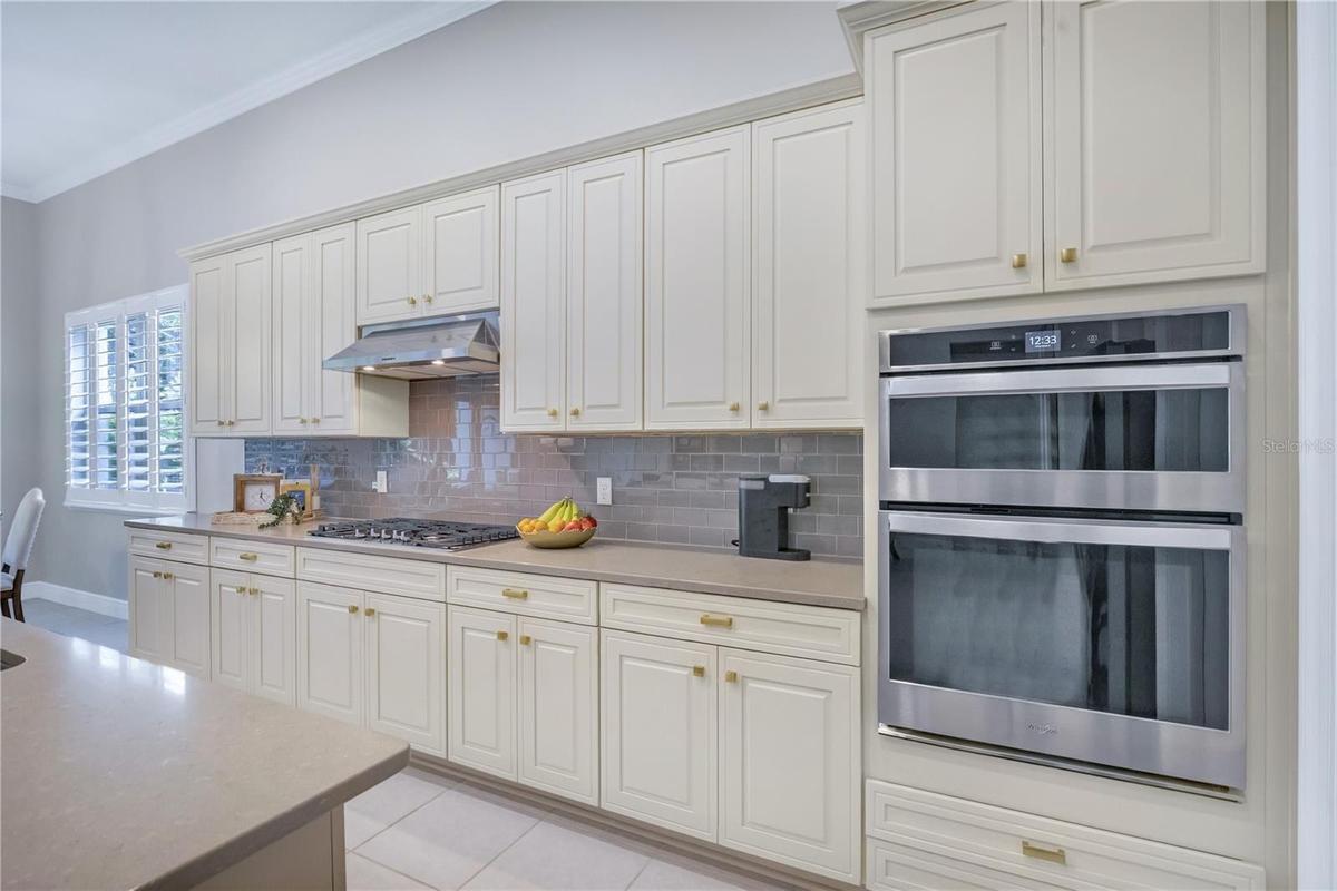 Beautifully appointed kitchen featuring generous counter space and stylish finishes.