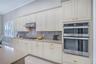 Beautifully appointed kitchen featuring generous counter space and stylish finishes.