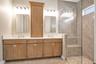 Bright bathroom featuring a contemporary vanity and stylish fixtures.