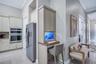 Convenient built-in computer workstation located just off the kitchen, featuring custom cabinetry and a dedicated workspace perfect for everyday tasks