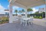 Covered community grilling and dining area, perfect for outdoor gatherings.