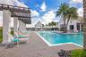 Enjoy the Florida sunshine from comfortable poolside seating and shaded relaxation areas.
