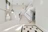 Inside, ETCHED-GLASS FRENCH DOORS open to a welcoming foyer with a SOARING CEILING and decorative tile flooring, setting the stage for the generous li
