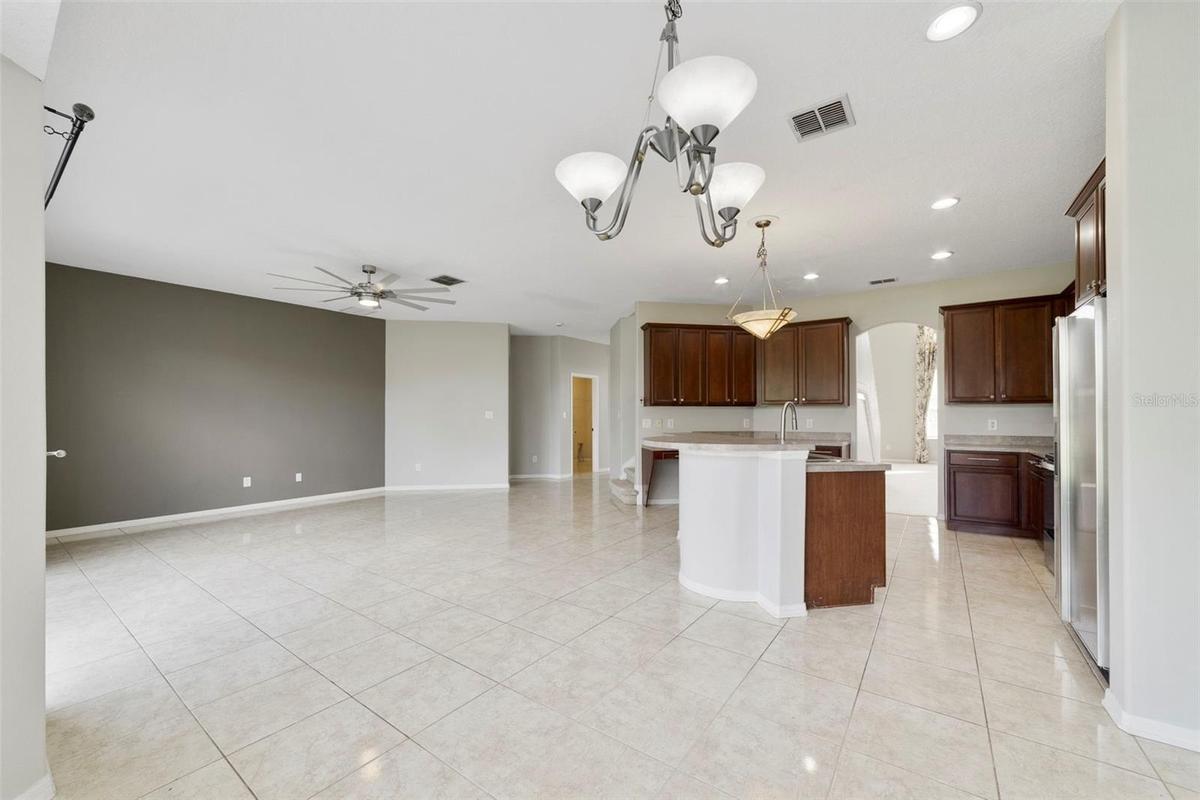 Stainless steel appliances and a SUNNY BREAKFAST NOOK with a bay window overlooking the backyard, complete this inviting space.