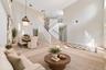 The formal LIVING ROOM/DINING ROOM COMBO share an elegant, open setting enhanced by 2-STORY CEILINGS where a chandelier and decorative ceiling medalli