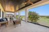 Balcony from primary bedroom, with retractable screens.