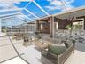 Outdoor Kitchen in pool area virtually staged
