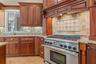 Kitchen-View Of Range & Cabinetry