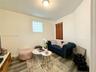 Wood-finish flooring, glass block window, and flush-mount ceiling lighting