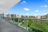 Covered balcony with a solid concrete floor and a glass-panel railing