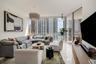 Floor-to-ceiling windows, polished tile flooring, pendant lighting, and an expansive balcony