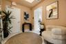Foyer featuring high-gloss tile flooring, recessed ceiling lighting, and a recessed ceiling architectural detail