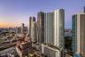 High-rise urban towers featuring glass facades, balconies, and multi-level structural designs